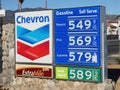 Sign with gas prices posted at a Chevron station. California has some of the highest fuel prices in the nation. Royalty Free Stock Photo