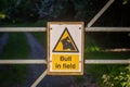 A warning of a bull sign in the countryside, with a shallow depth of field Royalty Free Stock Photo