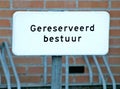 Sign `gereserveed bestuur ` on parket lot of the municipality of Zuidplas which means place is destinated for Mayor or one of the Royalty Free Stock Photo