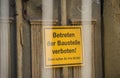 Sign with the German words for BEWARE OF TRESPASSING THE CONSTRUCTION SITE Royalty Free Stock Photo