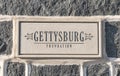 A sign for the Gettysburg Foundation imbedded into a stone wall Royalty Free Stock Photo