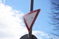 Sign give way against the blue sky Royalty Free Stock Photo