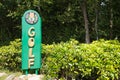 sign of a golfclub with the word golf in golden letters on green ground