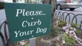 Sign, green white, Please curb your dog, city sidewalk, walkway