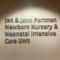 A sign in a hallway the says Jan and John Portman Newborn Nursery and Neonatal Intensive Care Unit