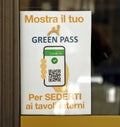 Sign hanging on a bar window in italian language. Only people with green pass can enter.