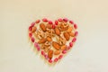 Sign heart lined with peeled pistachios, walnuts and almonds.