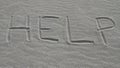 Sign Help in Sand Royalty Free Stock Photo