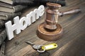 Sign Home, Key, Judges Gavel And Book On Wood Table