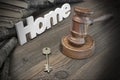 Sign Home, Key, Judges Gavel And Book On Wood Table Royalty Free Stock Photo