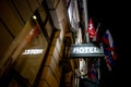 The sign of a hotel above an entrance in the night Royalty Free Stock Photo