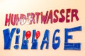 The sign of Hundertwasser Village in Vienna, Austria