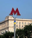 Sign indicating entrance to the Moscow metro station with Ukraine national colors in urban landscape front view