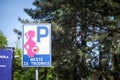 Sign indicating a parking spot reserved for pregnant women and expecting persons in a Serbian supermarket parking lot