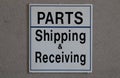 Sign indicating parts department and shipping & receiving