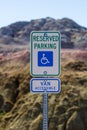 Sign indicating reserved parking for handicap with van access in the Badlands National Park. Royalty Free Stock Photo