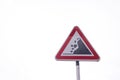 A sign indicating rocks falling on a white background located in the town of Funchal in Madeira Island in Portugal