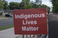 Sign indigenous lives matter at the memorial at catholic church in tribute to 215 indigenous aboriginal children