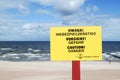 The sign informing about the danger in three languages - Polish, German and English.