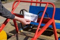 The sign with the inscription-Colored, on the car of the children`s playground