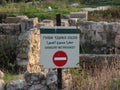 Sign with the inscription Danger! in National Park Tel Shikmona in Haifa Israel.