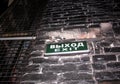 Sign with the inscription Exit on the black brick wall of the building