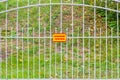 Sign with the inscription `protected area` on the fence