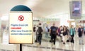 A sign inside an airport warns of the cancellation of flights form UK after new Covid-19 variant discover Royalty Free Stock Photo