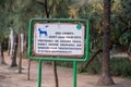 Sign inside Lodhi Garden, a large city park, reminding dog owners to pick up dog poop