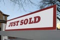 Sign just sold in front of a house in residential area Royalty Free Stock Photo