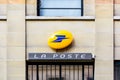 The sign of La Poste above the entrance of a post office in Paris, France