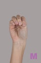 Sign language. Letter M made by fingers Royalty Free Stock Photo