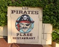 Sign for Les Pirates Plague Restaurant, located on it`s own private beach in Antibes, France.