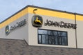 Sign and logo on building for John Deere in yellow and black