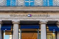 Sign and logo at the entrance to the Parisian flagship store of Tommy Hilfiger, Paris, France Royalty Free Stock Photo