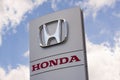 Sign with the logo of Honda Motor Company, Ltd. Japanese public multinational automobile brand. Royalty Free Stock Photo