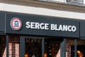 Sign and logo of a Serge Blanco boutique, Paris, France