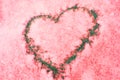 Sign of love-heart painted on snow, pastel pink background, Valentine's day Royalty Free Stock Photo