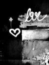Heart on a black concrete wall. Symbol of love. Graffiti.