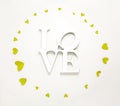 Sign Love top view valentines day decorations flat lay. Word Love and green yellow hearts isolated on white background Royalty Free Stock Photo