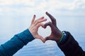 Sign of Love . White and black hands make heart symbol Royalty Free Stock Photo