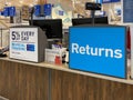 The sign at Lowes home improvement store that reads Returns Royalty Free Stock Photo