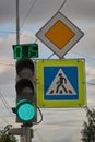 Sign main road. pedestrian crossing sign. green traffic signal with timer