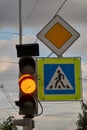 Sign main road. pedestrian crossing sign. yellow traffic signal Royalty Free Stock Photo