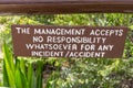 Sign - The Management accepts no responsiblity for any incident or accident - posted at a hotel resort to avoid getting sued Royalty Free Stock Photo