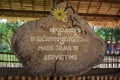 Sign marking location of mass grave in Killing Fields, Cambodia Royalty Free Stock Photo