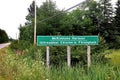 Sign for McKinnons Harbour with Gaelic and English name