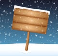 Sign on meadow with falling snow Royalty Free Stock Photo