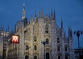 Sign metro station in Milan Italy with church on the background