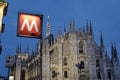 Sign metro station in Milan Italy with church on the background